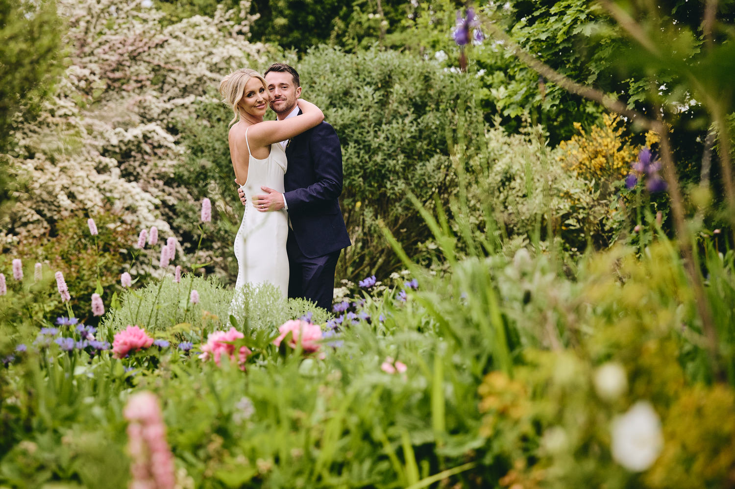 Bride & Groom pose for wedding photos at Wharfedale Grange wedding barn